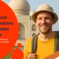 Smiling Western tourist in front of the Taj Mahal with text overlay 'Top 5 Most Asked Questions About Indian eVisa' and Indian flag design in the corner.